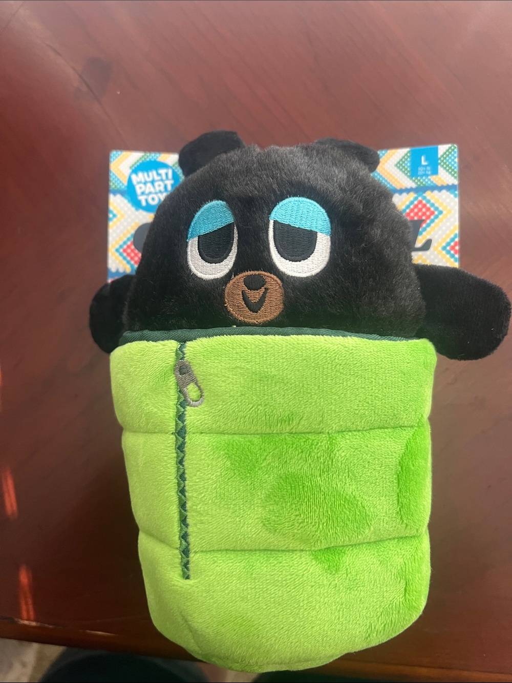 Plush Black Bear in Green Sleeping Bag Dog Toy